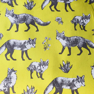 100% Yellow cotton fabric black and white foxes